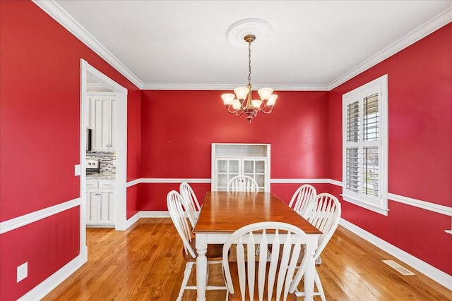 106 Irving Hills Ct, Lascassas, TN 37085 - dining room with visible vents, crown molding, light wood-type flooring, and a chandelier