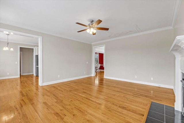 106 Irving Hills Ct, Lascassas, TN 37085 - unfurnished living room featuring a fireplace with flush hearth, light wood-style flooring, baseboards, ceiling fan with notable chandelier, and ornamental molding