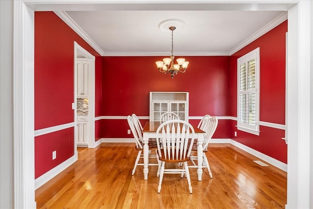 106 Irving Hills Ct, Lascassas, TN 37085 - dining area featuring visible vents, crown molding, baseboards, wood finished floors, and a notable chandelier