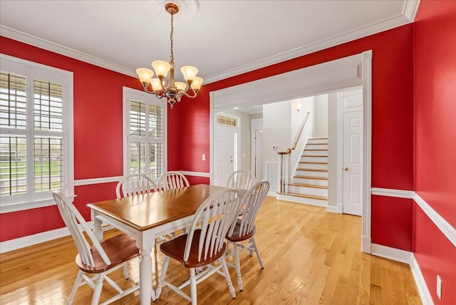 106 Irving Hills Ct, Lascassas, TN 37085 - dining space featuring an inviting chandelier, ornamental molding, light wood-style floors, and stairway
