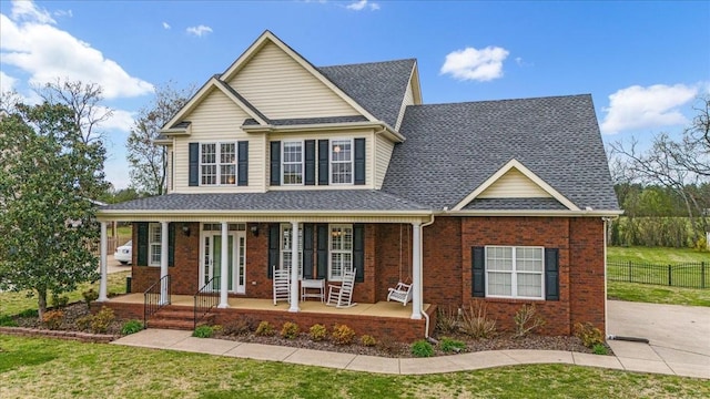 106 Irving Hills Ct, Lascassas, TN 37085 - view of front of house with fence, a front yard, a porch, and brick siding
