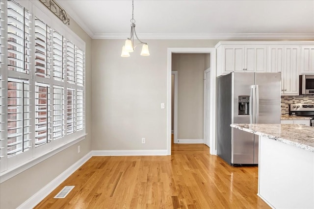 106 Irving Hills Ct, Lascassas, TN 37085 - kitchen featuring white cabinetry, crown molding, stainless steel appliances, visible vents, and light wood-style flooring