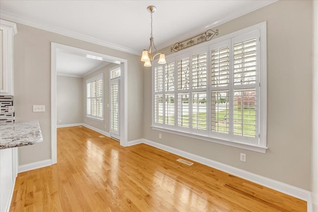 106 Irving Hills Ct, Lascassas, TN 37085 - unfurnished dining area featuring visible vents, a chandelier, crown molding, baseboards, and light wood-type flooring