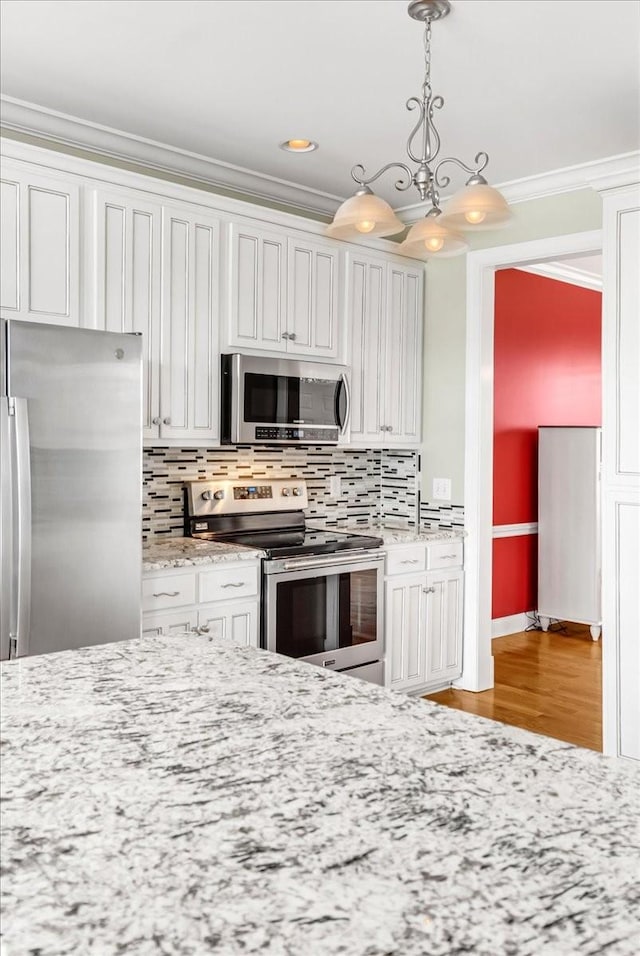 106 Irving Hills Ct, Lascassas, TN 37085 - kitchen with light wood finished floors, stainless steel appliances, ornamental molding, and tasteful backsplash