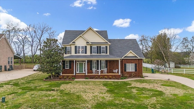 106 Irving Hills Ct, Lascassas, TN 37085 - view of front of house featuring driveway, a front yard, fence, and brick siding