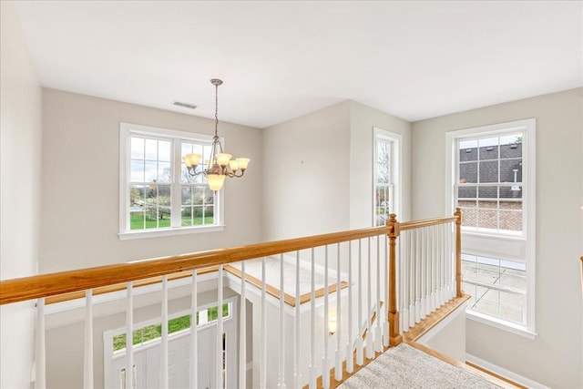 106 Irving Hills Ct, Lascassas, TN 37085 - hall featuring an upstairs landing, a chandelier, and visible vents