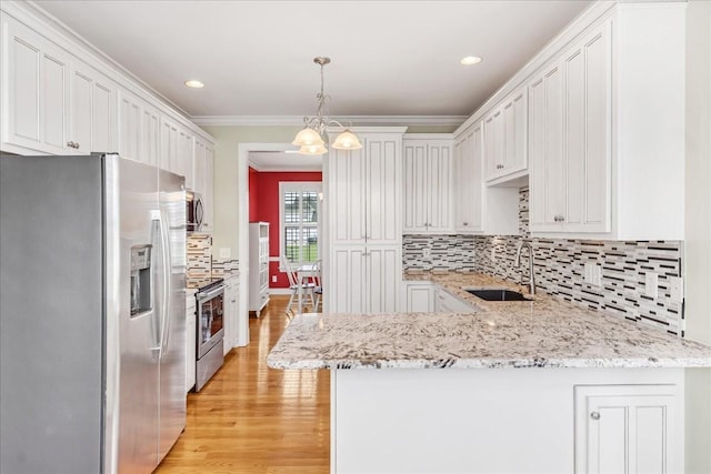 106 Irving Hills Ct, Lascassas, TN 37085 - kitchen featuring light wood-style flooring, a peninsula, ornamental molding, stainless steel appliances, and a sink
