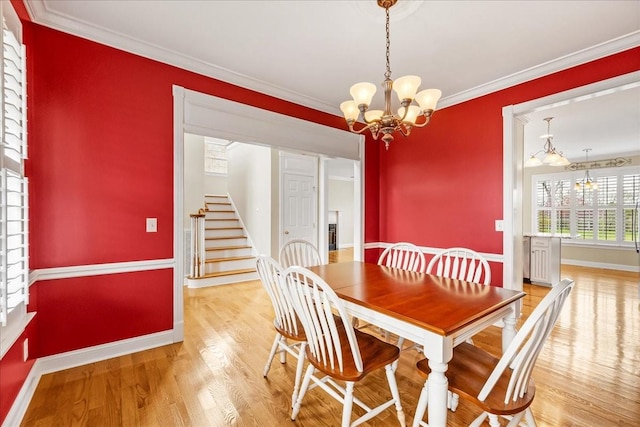 106 Irving Hills Ct, Lascassas, TN 37085 - dining area featuring stairway, ornamental molding, baseboards, a chandelier, and wood finished floors