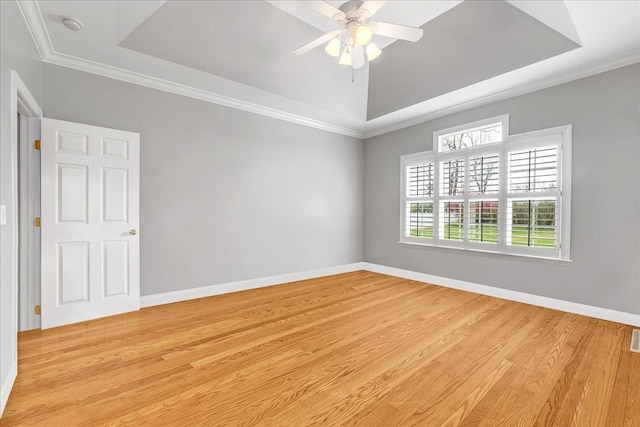 106 Irving Hills Ct, Lascassas, TN 37085 - spare room featuring a tray ceiling, baseboards, and light wood-type flooring