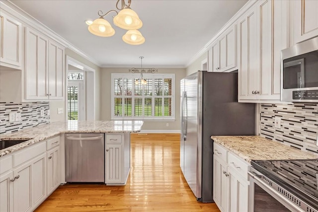 106 Irving Hills Ct, Lascassas, TN 37085 - kitchen featuring light wood finished floors, a notable chandelier, crown molding, and appliances with stainless steel finishes