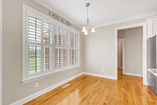 106 Irving Hills Ct, Lascassas, TN 37085 - unfurnished dining area with baseboards, light wood-type flooring, crown molding, and a chandelier
