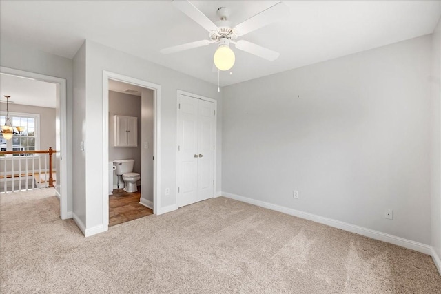 106 Irving Hills Ct, Lascassas, TN 37085 - unfurnished bedroom with ensuite bathroom, carpet flooring, a closet, baseboards, and ceiling fan with notable chandelier