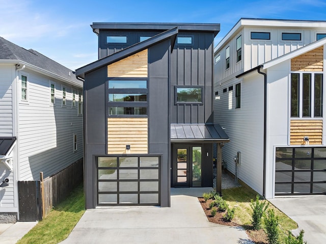 843B Dewees Ave, Nashville, TN 37204 - view of front facade with a standing seam roof, concrete driveway, board and batten siding, metal roof, and a garage