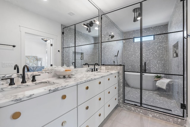 843B Dewees Ave, Nashville, TN 37204 - bathroom featuring a shower stall, double vanity, tile patterned flooring, and a sink