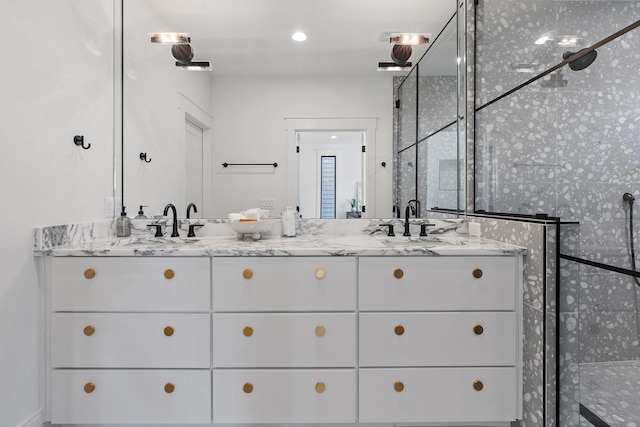 843B Dewees Ave, Nashville, TN 37204 - bathroom featuring a sink, double vanity, and a tile shower