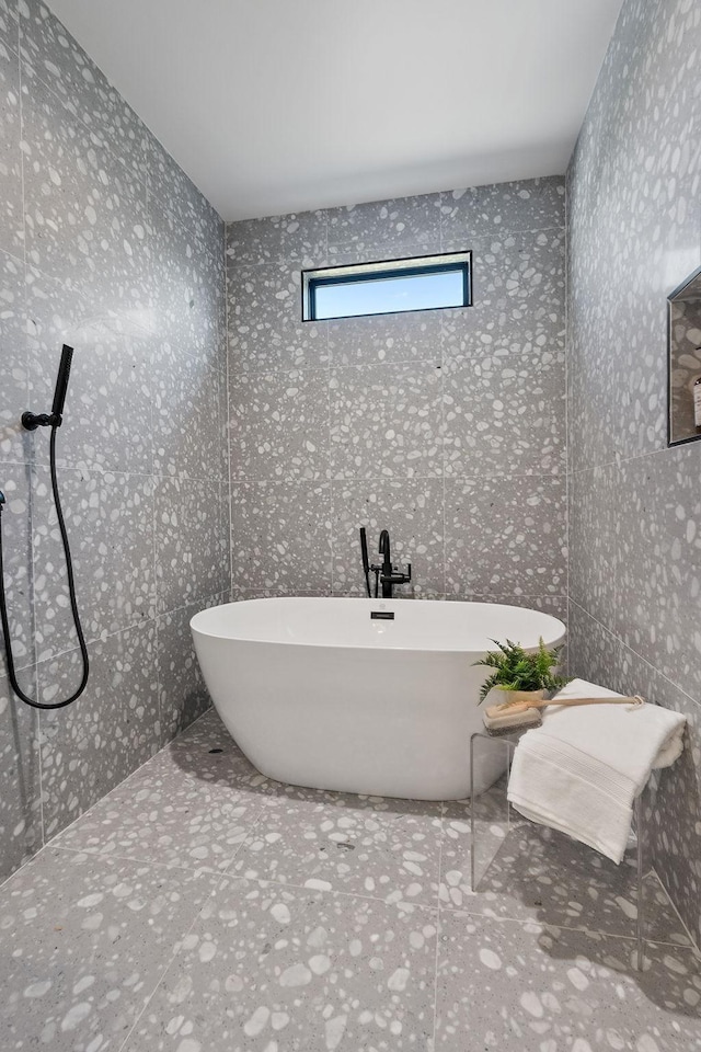 843B Dewees Ave, Nashville, TN 37204 - bathroom with a shower, a freestanding bath, and tile patterned flooring