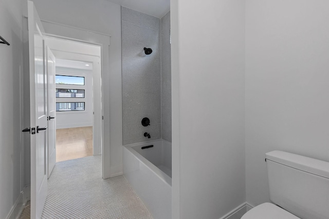 843B Dewees Ave, Nashville, TN 37204 - full bath with baseboards, toilet, tile patterned flooring, and bathing tub / shower combination