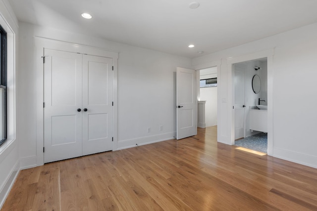 843B Dewees Ave, Nashville, TN 37204 - unfurnished bedroom featuring light wood-style flooring, connected bathroom, baseboards, and recessed lighting