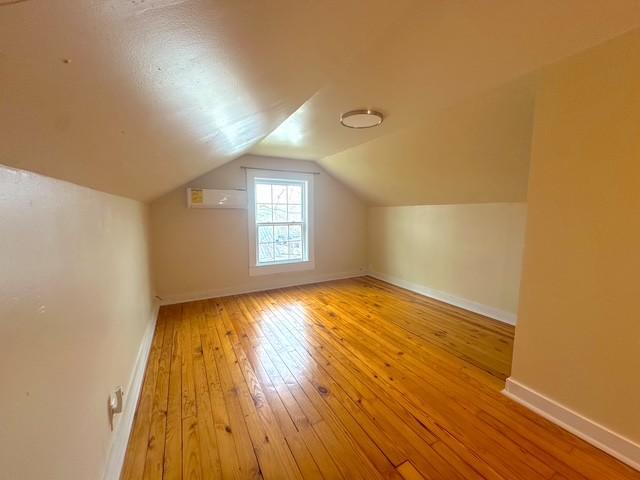 522 Norris Hancock, Big Rock, TN 37023 - additional living space featuring baseboards, hardwood / wood-style flooring, and lofted ceiling