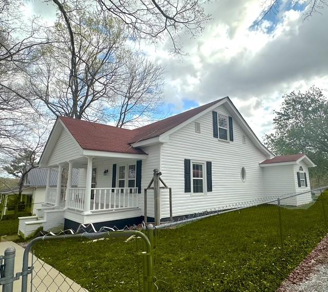 522 Norris Hancock, Big Rock, TN 37023 - view of home's exterior with a yard, covered porch, and fence private yard