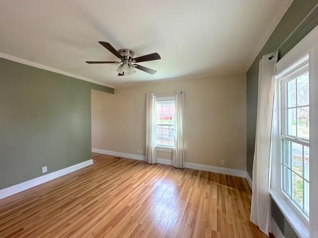 522 Norris Hancock, Big Rock, TN 37023 - empty room with crown molding, ceiling fan, baseboards, and light wood-style floors