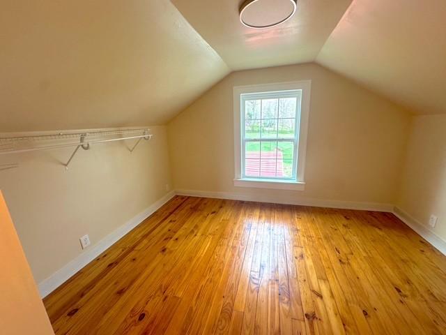 522 Norris Hancock, Big Rock, TN 37023 - additional living space with light wood-style flooring, baseboards, and lofted ceiling