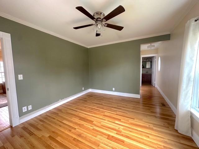 522 Norris Hancock, Big Rock, TN 37023 - unfurnished room featuring crown molding, baseboards, and light wood-type flooring