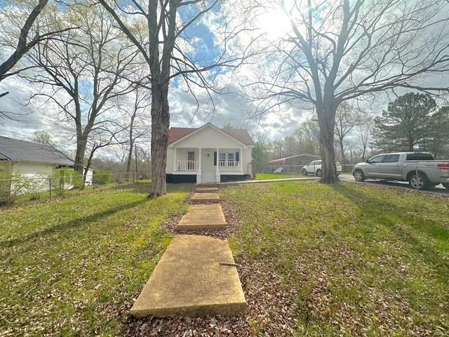 522 Norris Hancock, Big Rock, TN 37023 - bungalow-style home featuring covered porch, a front yard, and fence