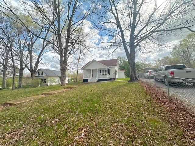 522 Norris Hancock, Big Rock, TN 37023 - view of yard featuring a porch and fence
