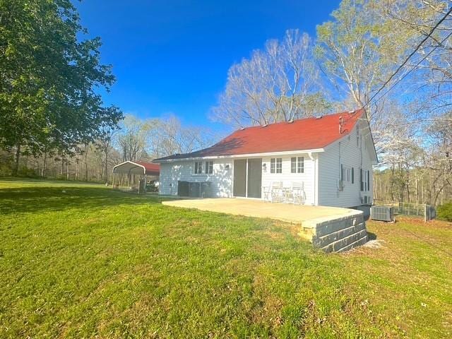 522 Norris Hancock, Big Rock, TN 37023 - rear view of house with a yard, a carport, and central air condition unit