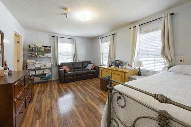 328 Cumberland St W, Cowan, TN 37318 - bedroom featuring dark wood-style flooring and a textured ceiling