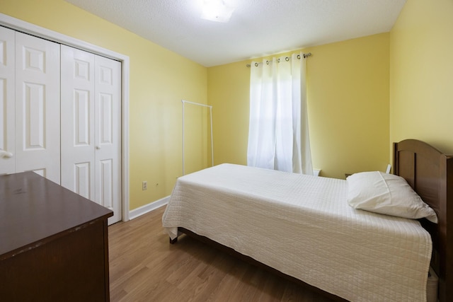 328 Cumberland St W, Cowan, TN 37318 - bedroom with wood finished floors and a closet