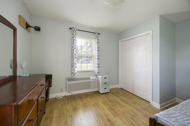 328 Cumberland St W, Cowan, TN 37318 - bedroom featuring light wood finished floors, a closet, and an AC wall unit
