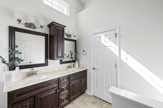 bathroom featuring double vanity and a sink