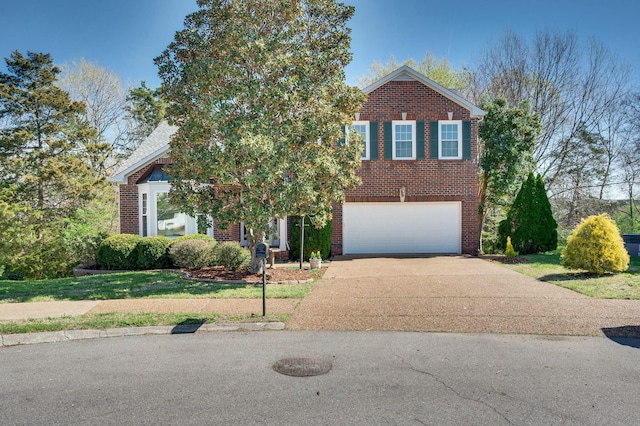 view of front of property with a front yard, brick siding, concrete driveway, and an attached garage