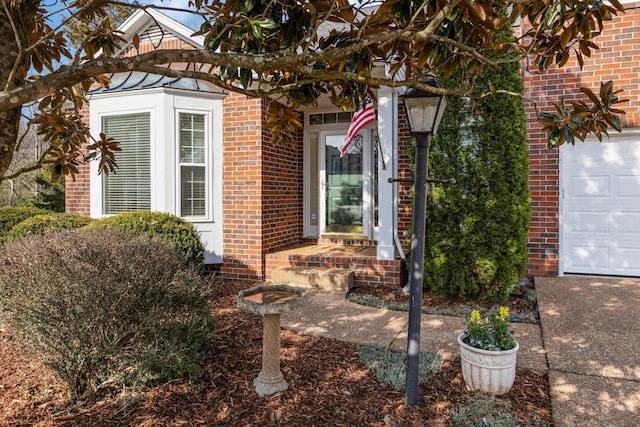 doorway to property with brick siding