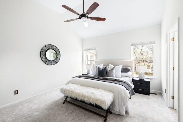 bedroom featuring baseboards, high vaulted ceiling, a ceiling fan, and light colored carpet