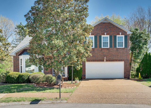view of front of home featuring an attached garage, brick siding, and concrete driveway