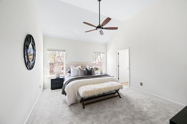 bedroom featuring light carpet, baseboards, high vaulted ceiling, and a ceiling fan