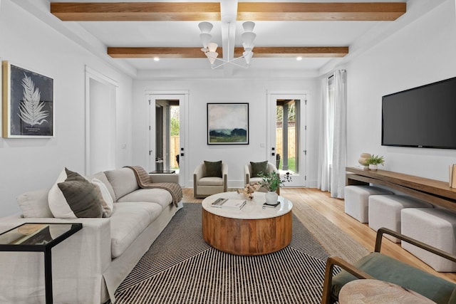 3411 Richards St, Nashville, TN 37215 - living area featuring light wood finished floors, a wealth of natural light, a notable chandelier, and beam ceiling