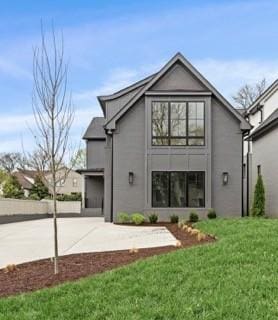 3411 Richards St, Nashville, TN 37215 - back of house with a lawn, concrete driveway, and stucco siding