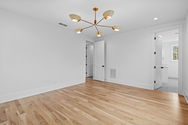 3411 Richards St, Nashville, TN 37215 - spare room featuring light wood-type flooring, a notable chandelier, baseboards, and visible vents