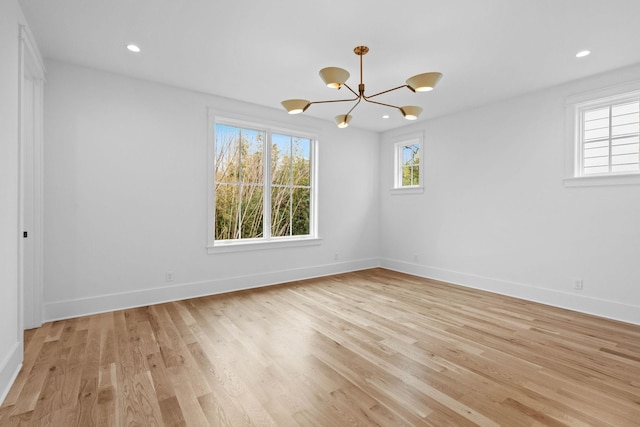 3411 Richards St, Nashville, TN 37215 - unfurnished room with an inviting chandelier, light wood-style flooring, baseboards, and a healthy amount of sunlight