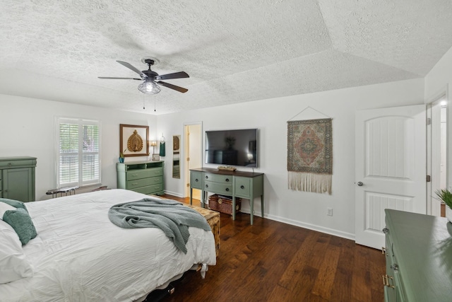 bedroom with a textured ceiling, baseboards, ceiling fan, and wood finished floors