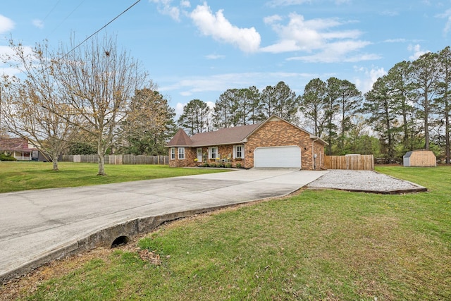 view of front of property with a front yard, fence, a garage, and concrete driveway