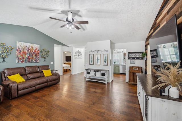 living area with a textured ceiling, dark wood-style floors, ceiling fan, and lofted ceiling