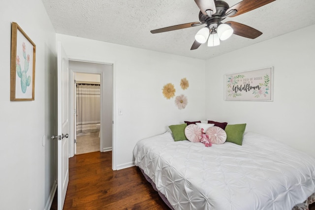 bedroom featuring baseboards, wood finished floors, ceiling fan, and a textured ceiling