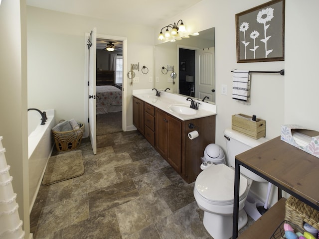 7912 Peridot Cir, Murfreesboro, TN 37127 - bathroom featuring stone finish flooring, ensuite bathroom, toilet, a ceiling fan, and double vanity