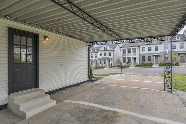 uncovered parking lot featuring entry steps and a residential view