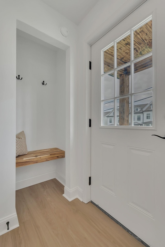 mudroom with baseboards and light wood finished floors